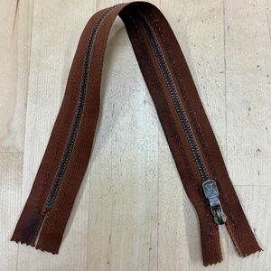 Louis Vuitton 12” Brass Zipper Rust Color